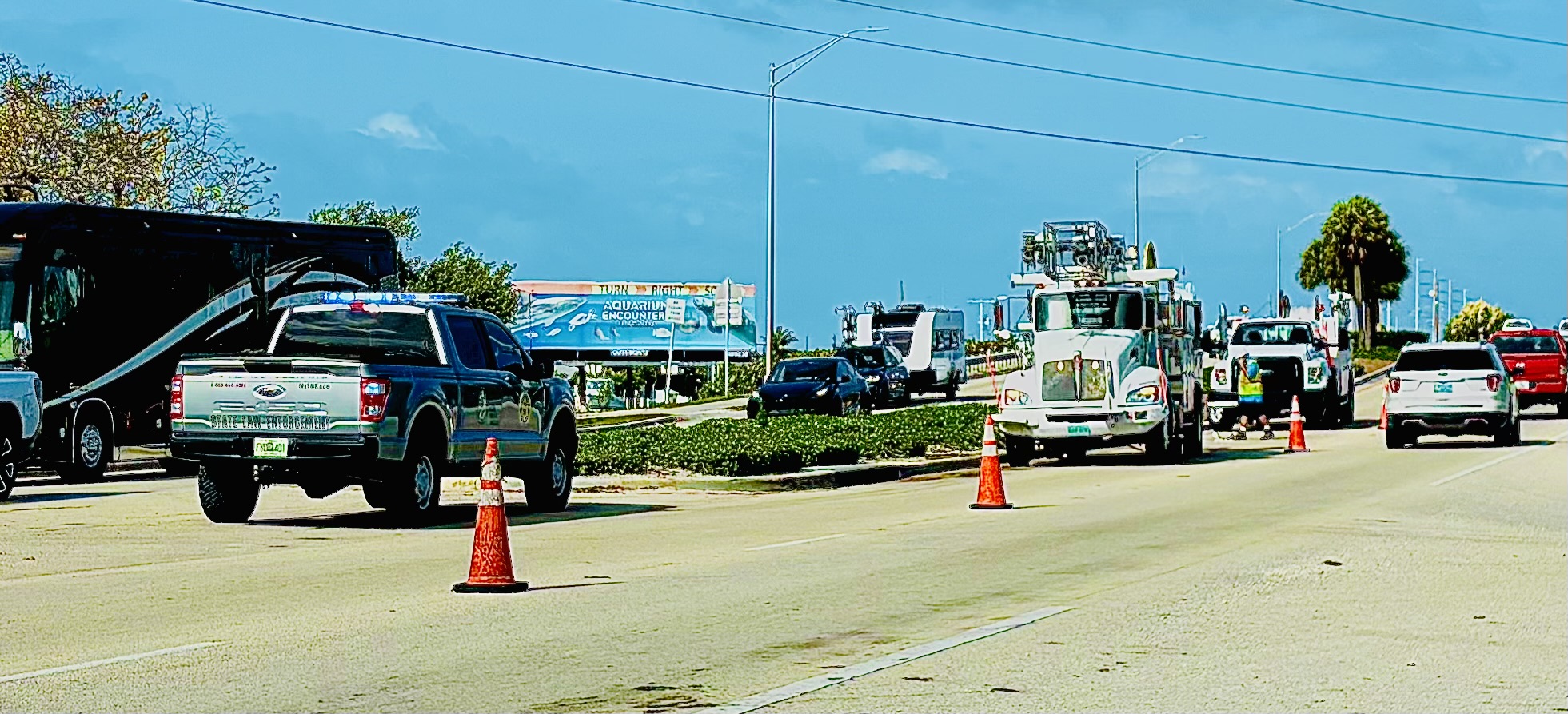 Law enforcement vehicle on a Florida Keys road during a traffic control detail.